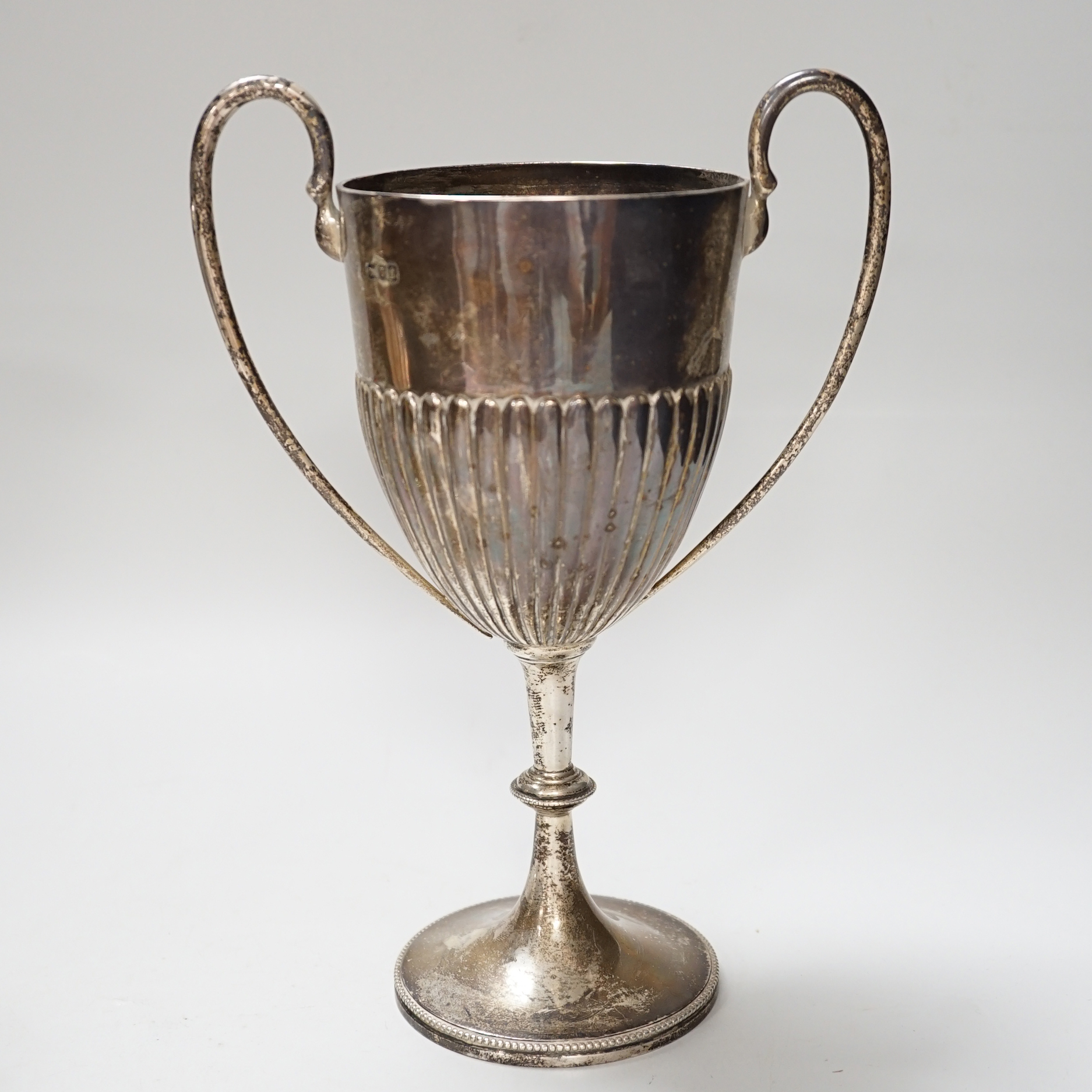 An Edwardian two handled silver trophy cup with demi fluted body, London 1901, 25.5cm, 358 grams